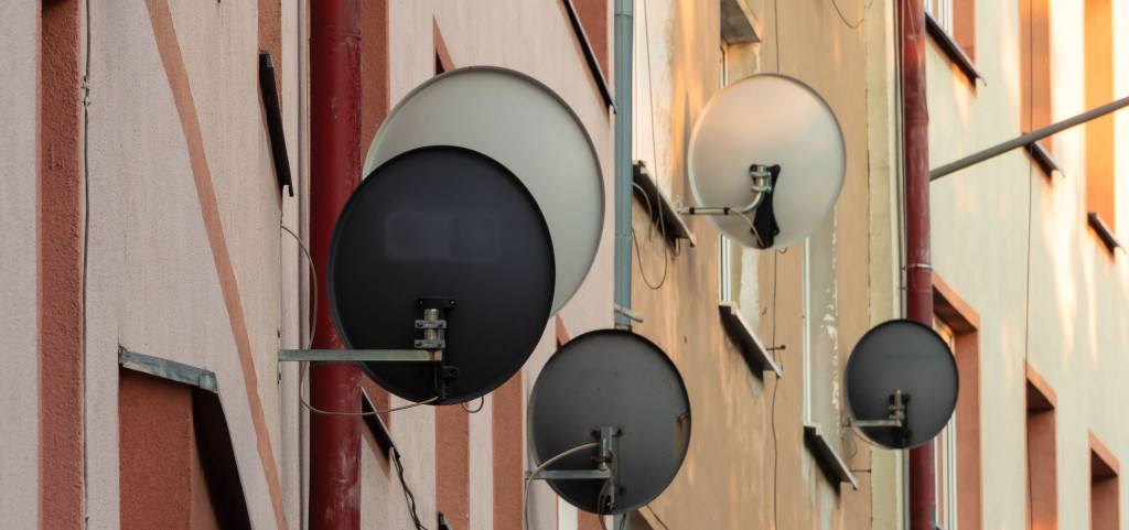 Photo of satellite dishes on an apartment complex